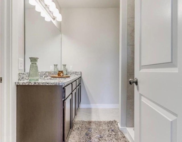 bathroom with vanity and tile patterned flooring