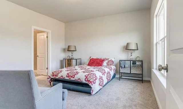 bedroom featuring light colored carpet