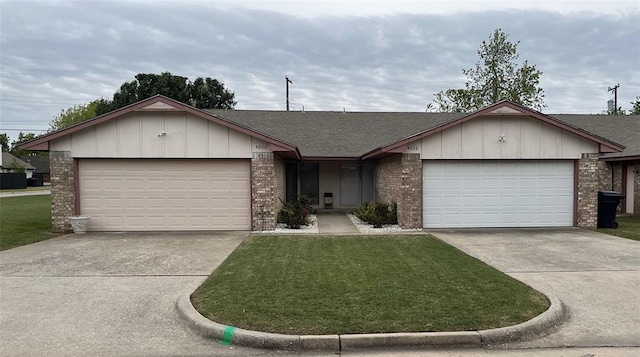 ranch-style house featuring a garage and a front yard