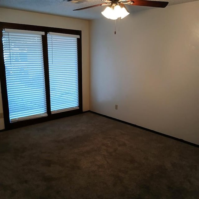 carpeted empty room with ceiling fan