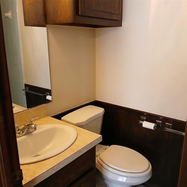 bathroom featuring vanity and toilet