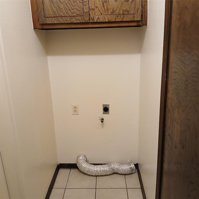 laundry area with light tile patterned flooring and electric dryer hookup