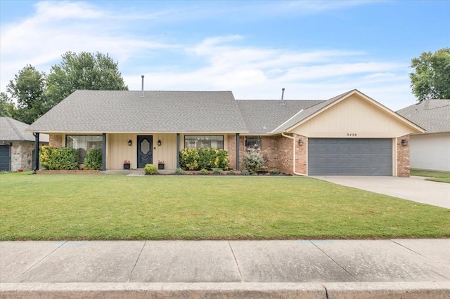 ranch-style house with a garage and a front lawn