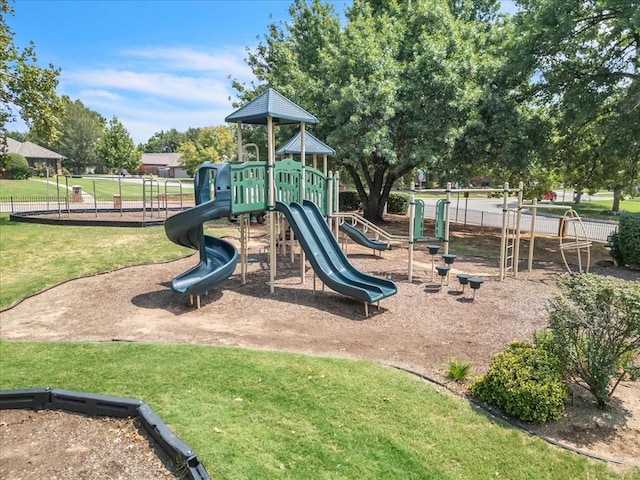 view of jungle gym with a lawn