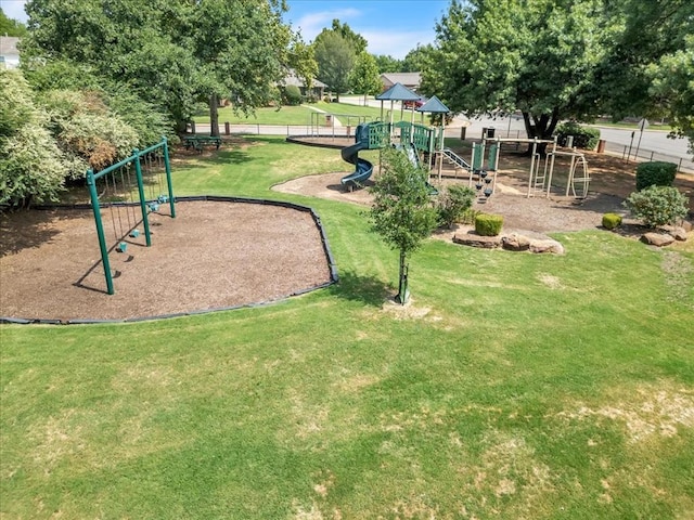 surrounding community featuring a lawn and a playground