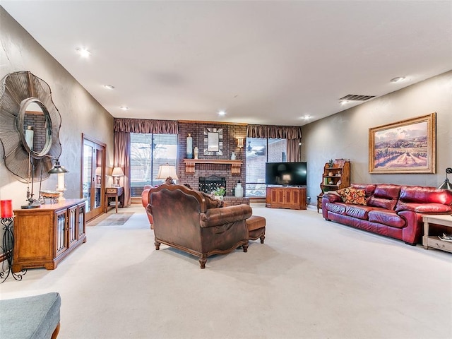 living room with light carpet and a brick fireplace