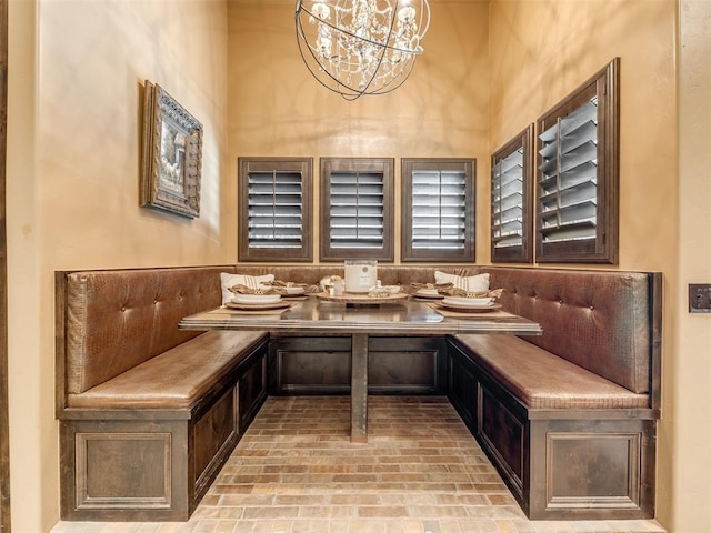 interior space featuring a chandelier and breakfast area