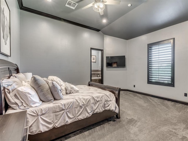 carpeted bedroom featuring ensuite bath, ornamental molding, and ceiling fan