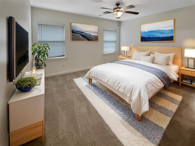 bedroom featuring dark carpet and ceiling fan