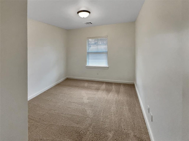 empty room with carpet flooring