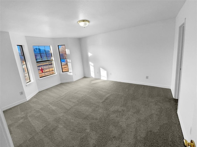 empty room with dark carpet