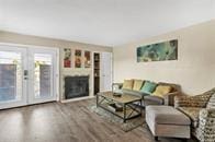 living room with hardwood / wood-style flooring and french doors