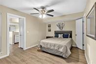 bedroom featuring ceiling fan and light hardwood / wood-style floors