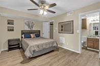 bedroom featuring ceiling fan and light wood-type flooring