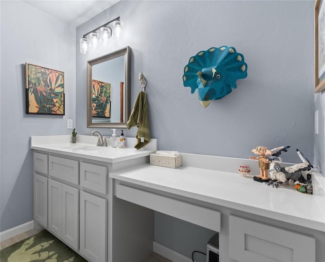 bathroom featuring vanity and wood finished floors
