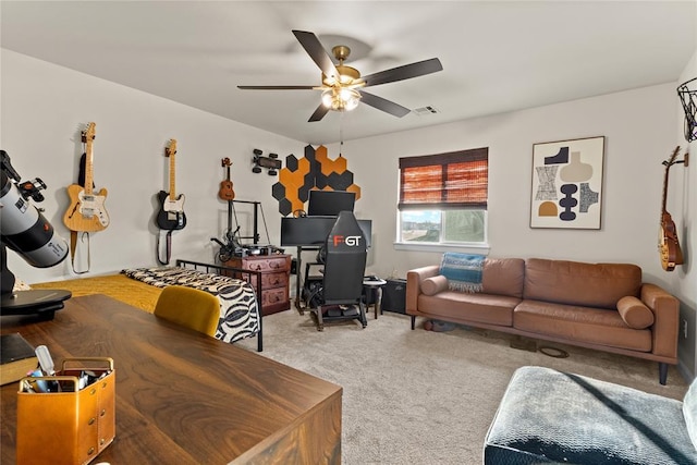 carpeted living area featuring visible vents and ceiling fan