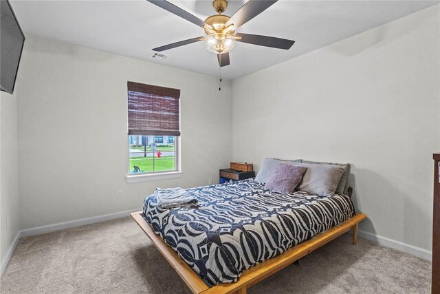 2802 Cloud Nine Cir, Weatherford, OK 73096 - carpeted bedroom with baseboards and a ceiling fan
