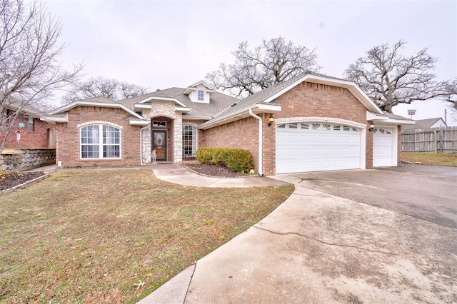 view of front of property with a garage and a front lawn