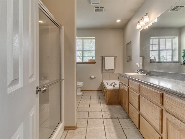 full bathroom featuring tile patterned floors, toilet, separate shower and tub, and vanity