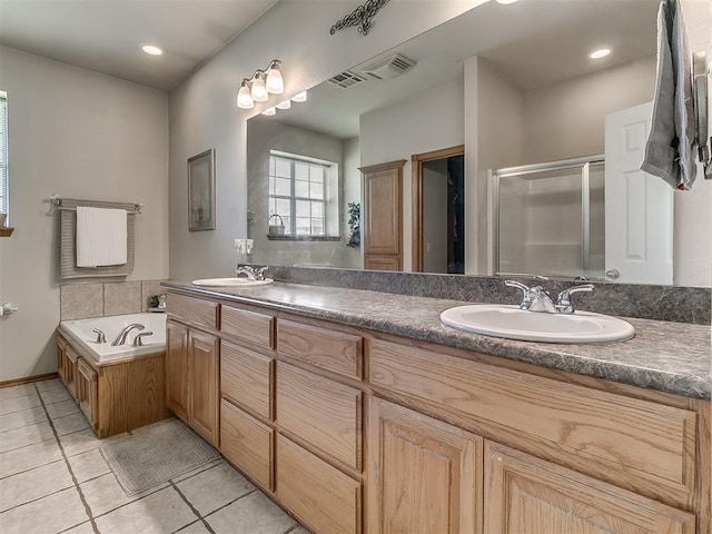 bathroom featuring tile patterned floors, independent shower and bath, and vanity