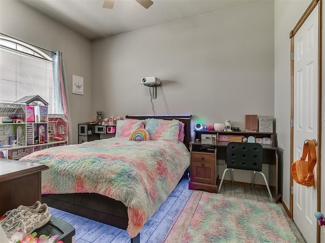 bedroom featuring light hardwood / wood-style floors and ceiling fan