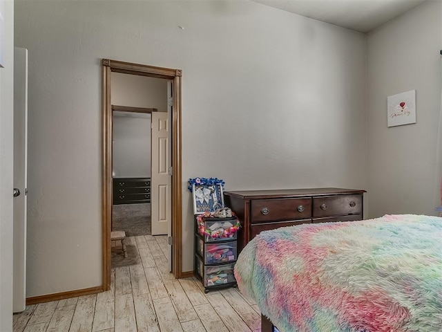 bedroom with light wood-type flooring