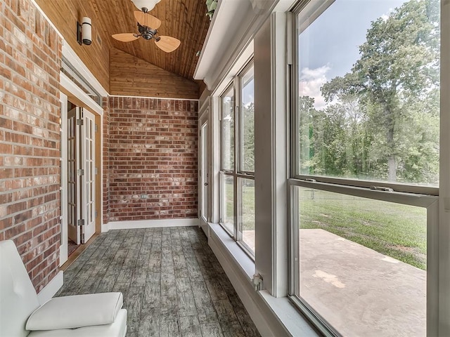 unfurnished sunroom featuring lofted ceiling and wooden ceiling