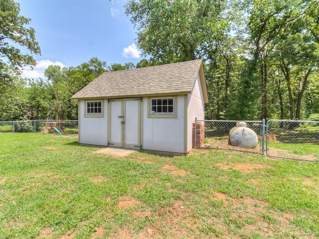 view of outdoor structure featuring a lawn