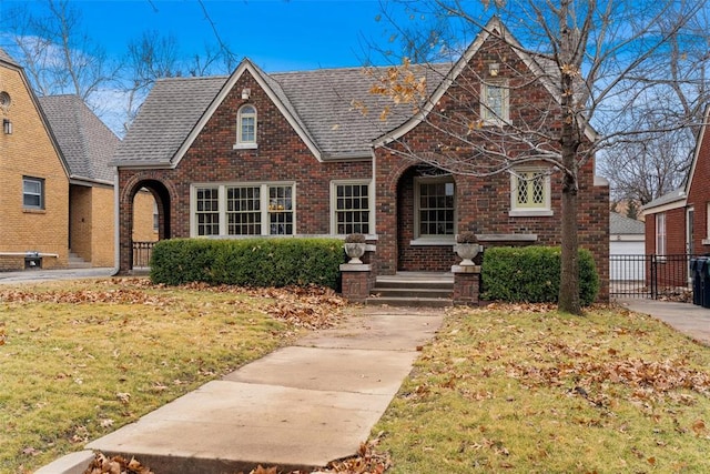 tudor house with a front lawn