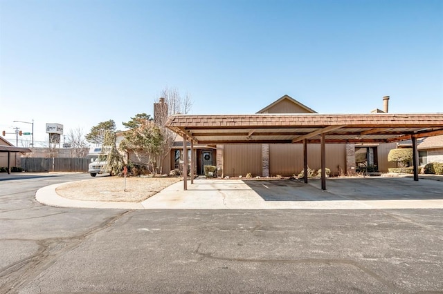 view of vehicle parking featuring a carport