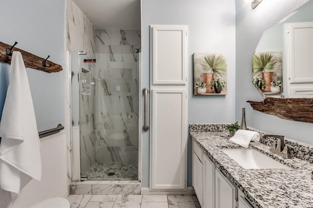 bathroom with vanity and an enclosed shower