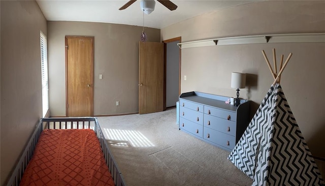 bedroom with ceiling fan and carpet floors