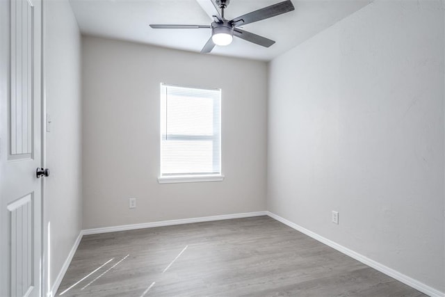 unfurnished room featuring hardwood / wood-style flooring and ceiling fan