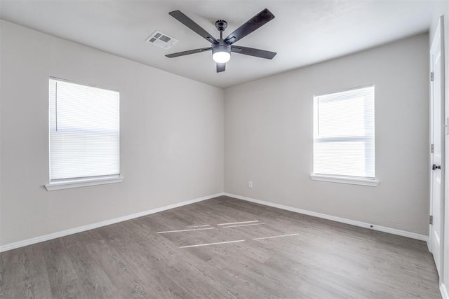 unfurnished room featuring ceiling fan and wood-type flooring