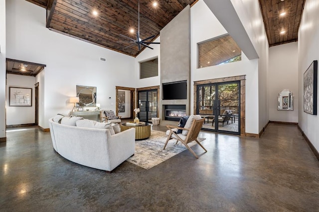 living room with a towering ceiling and wood ceiling