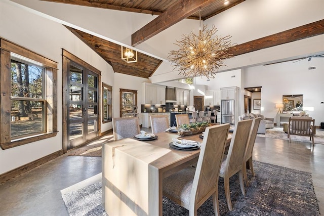 dining room with beamed ceiling, a chandelier, high vaulted ceiling, and french doors