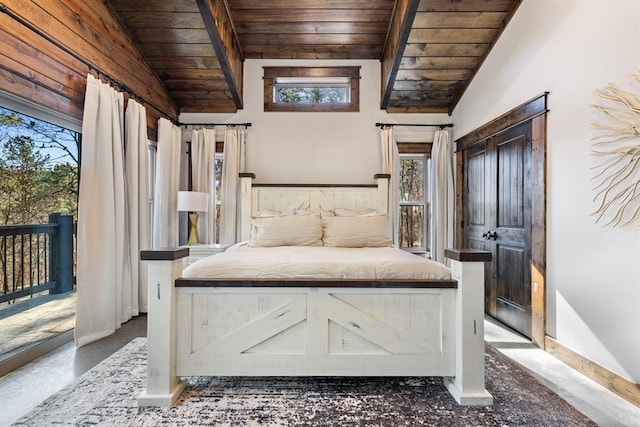 unfurnished bedroom with multiple windows, vaulted ceiling with beams, wood ceiling, and access to exterior