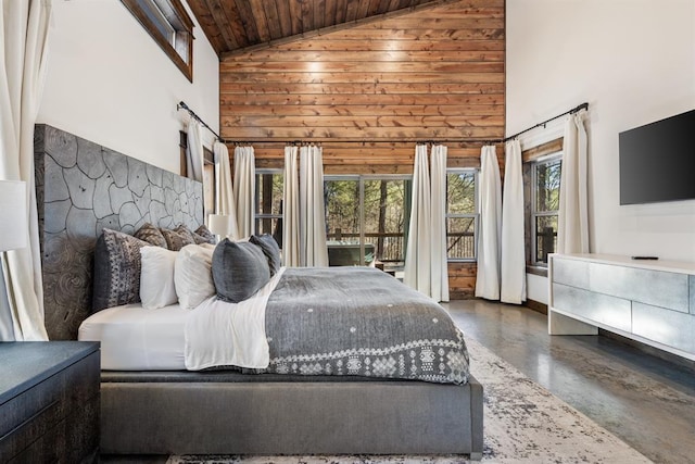 bedroom with high vaulted ceiling, concrete floors, and wooden ceiling