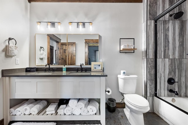 full bathroom with enclosed tub / shower combo, vanity, and toilet