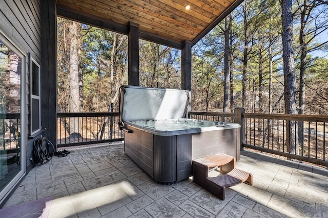 exterior space with a hot tub