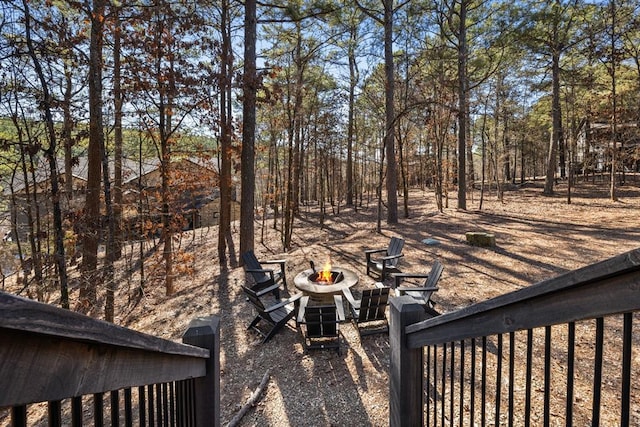 view of yard with an outdoor fire pit