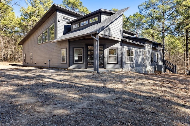 rear view of house with a patio and central air condition unit