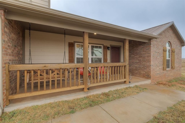 doorway to property with a porch