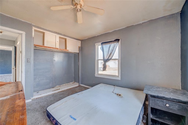 carpeted bedroom with a closet and ceiling fan