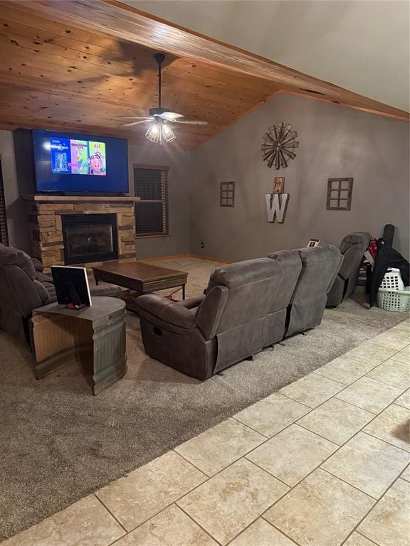 728 S Carol St, Carnegie, OK 73015 - living area with a stone fireplace, wooden ceiling, lofted ceiling, a ceiling fan, and tile patterned flooring