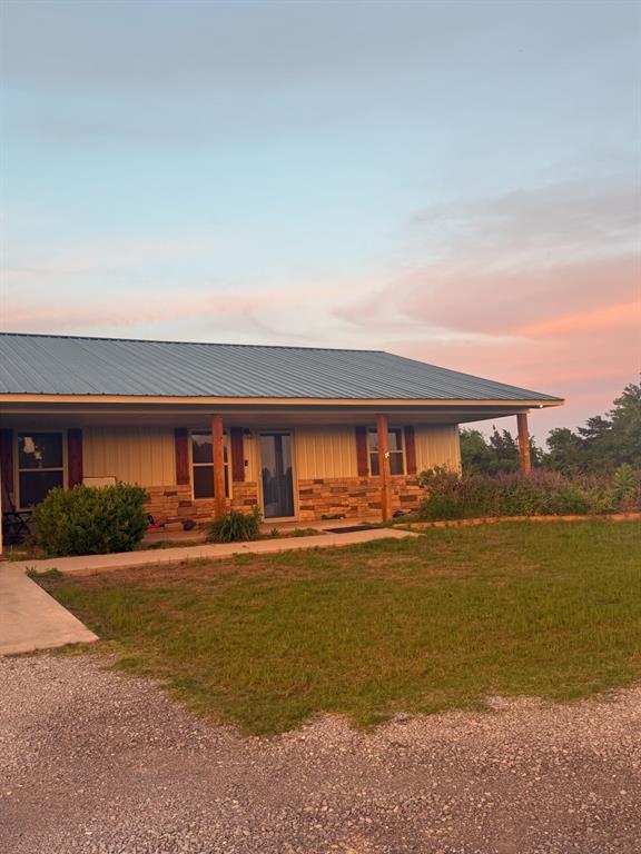 728 S Carol St, Carnegie, OK 73015 - view of front of property featuring a yard and covered porch