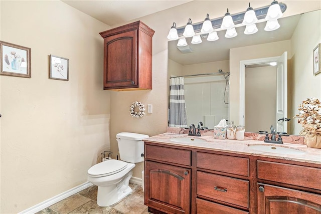 bathroom featuring vanity, a shower with curtain, and toilet