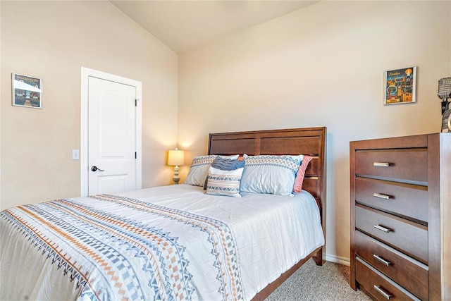 carpeted bedroom with vaulted ceiling