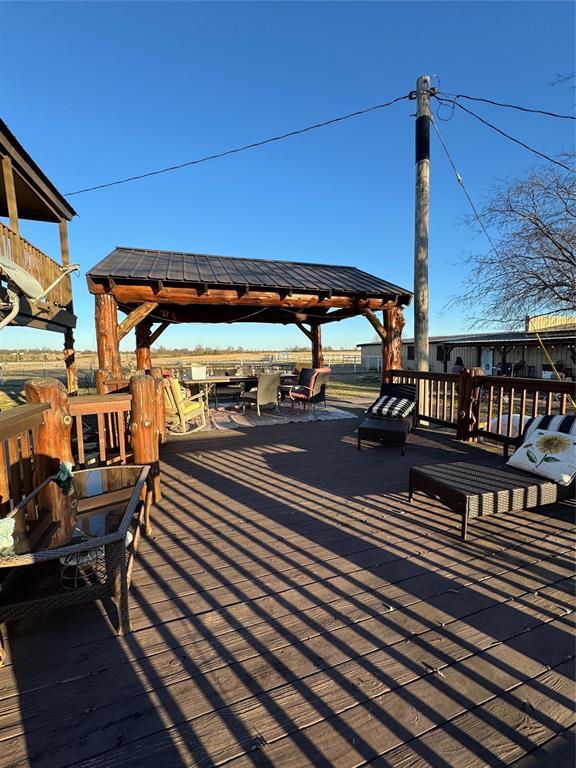 wooden deck featuring a gazebo