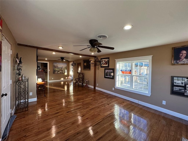 interior space featuring hardwood / wood-style flooring and ceiling fan